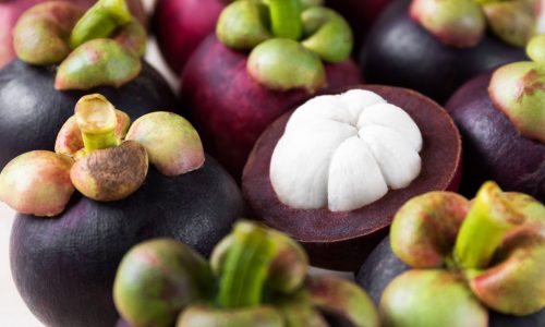 close-up-mangosteen-stack-tropical-fruit close-up-mangosteen-stack-tropical-fruit