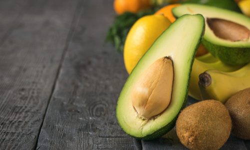 sliced-avocado-tangerines-oranges-kiwi-bananas-vintage-black-table-vegetarian-food sliced-avocado-tangerines-oranges-kiwi-bananas-vintage-black-table-vegetarian-food
